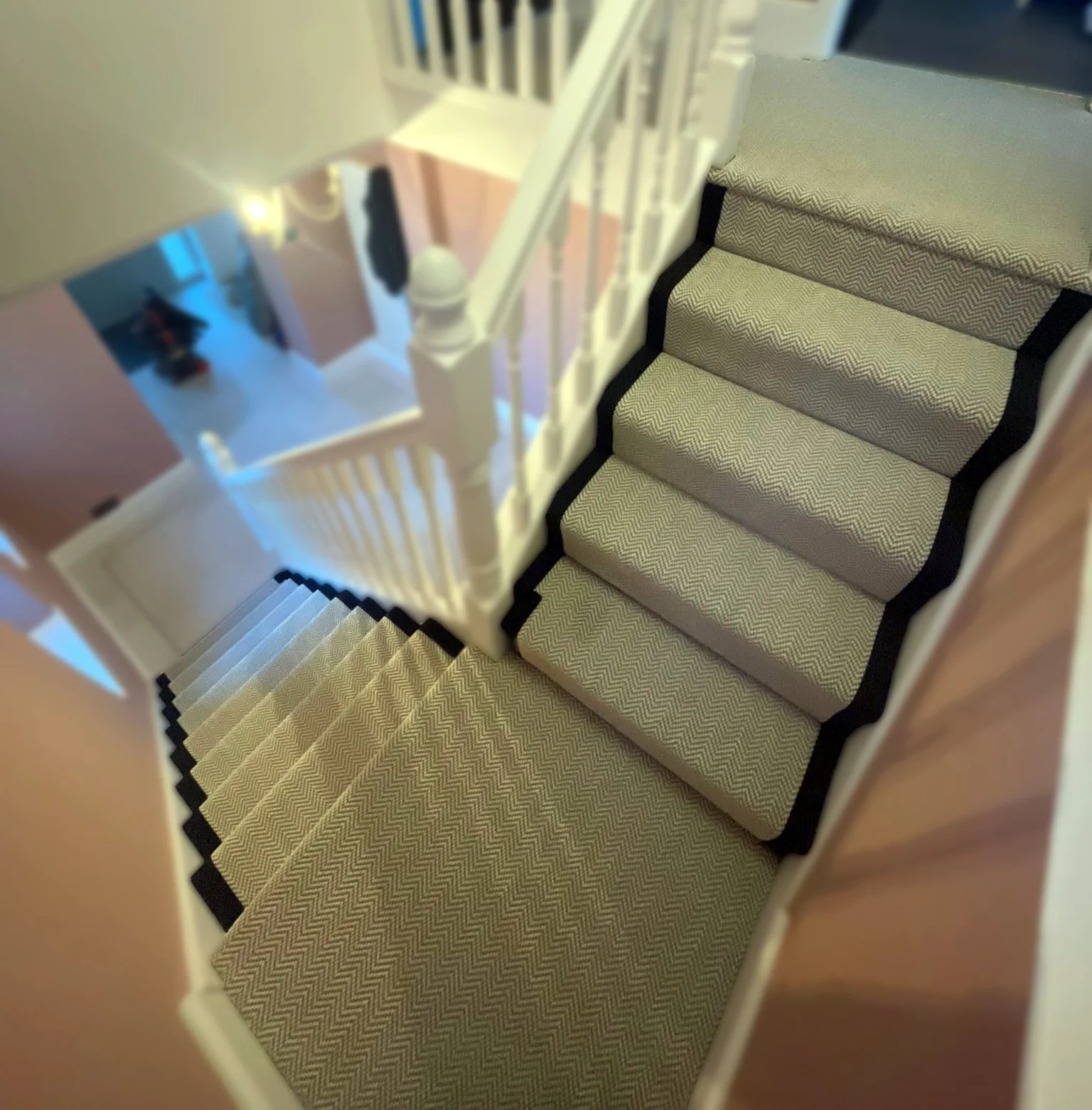 Herringbone stair runner with contrasting dark edge tape